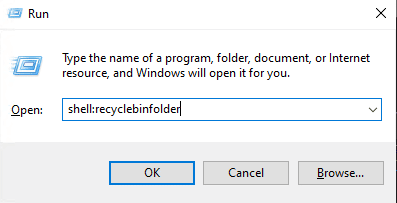 The Windows Run dialog box is open with "shell:recyclebinfolder" typed inside.