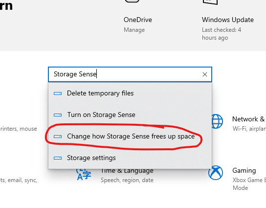 Windows 10 Settings App where we have typed "Storage Sense" into the search bar and this time we are selecting the third option down called "Change ho Storage Sense frees up space"